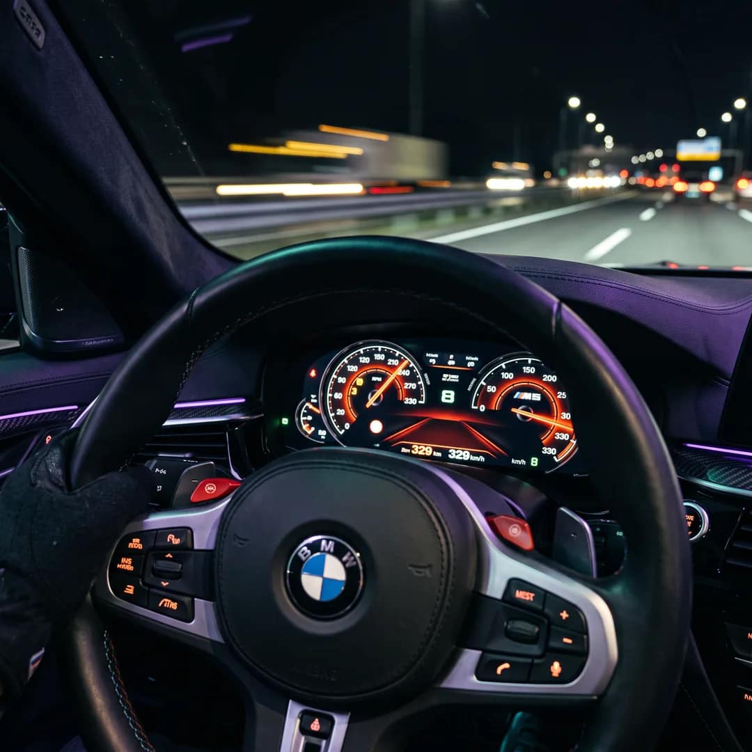 The driver-seat view of a high-performance car cockpit at speed